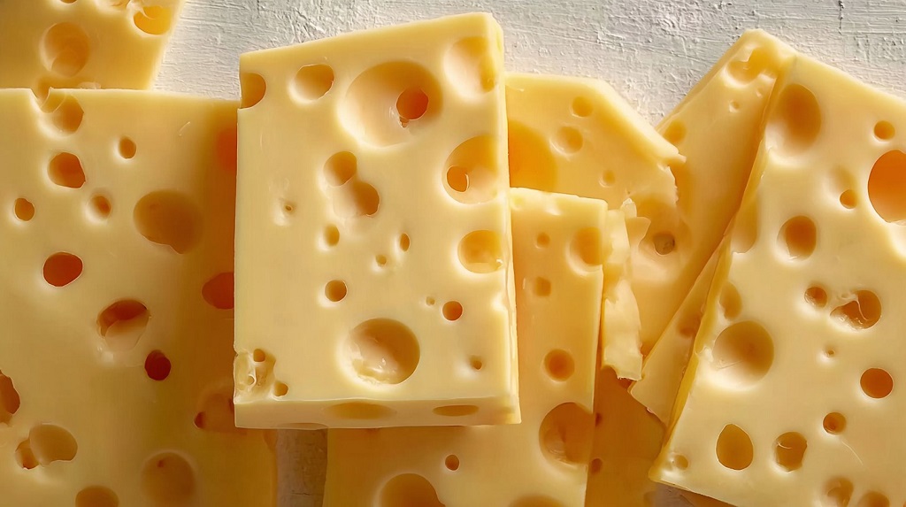 Slices of Swiss cheese with signature holes stacked together