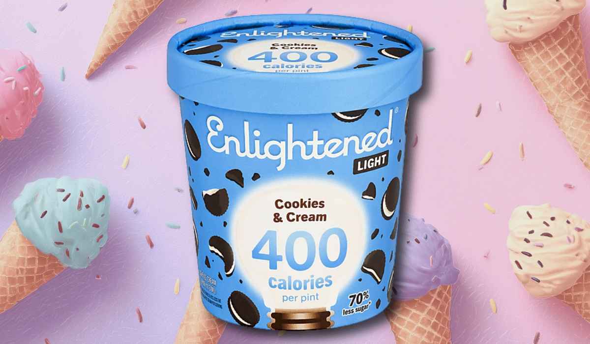 Enlightened Light Cookies & Cream ice cream pint with blue packaging on a pastel background decorated with colorful ice cream cones and sprinkles