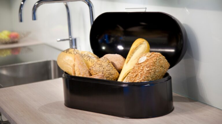 Bread loaves inside a bread box on a kitchen counter to store bread properly