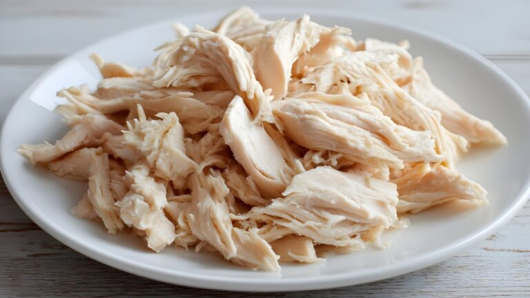 Cooked chicken on a plate shown as an example of food that may no longer be safe to eat