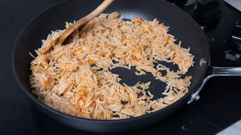 Rice in a pan being reheated once to keep leftovers from drying out